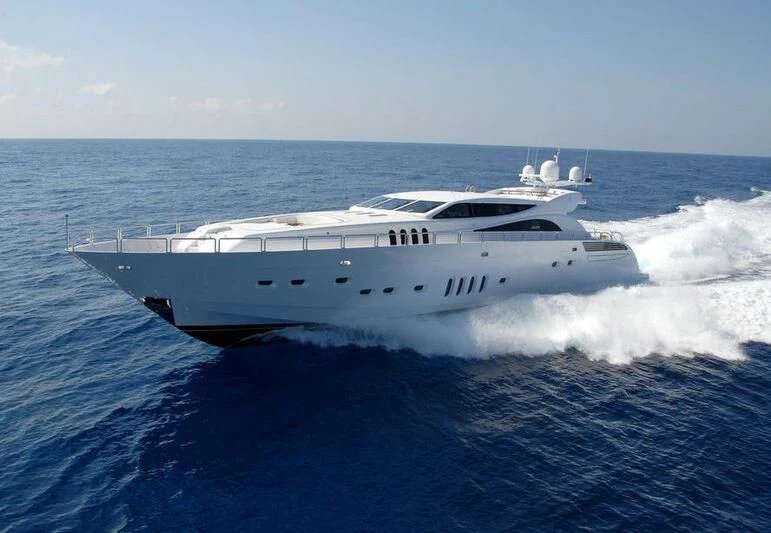 a white yacht in the water aboard YOLO Yacht for Sale