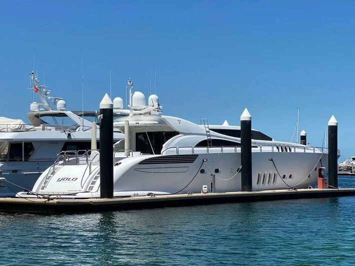 a large white boat in the water aboard YOLO Yacht for Sale
