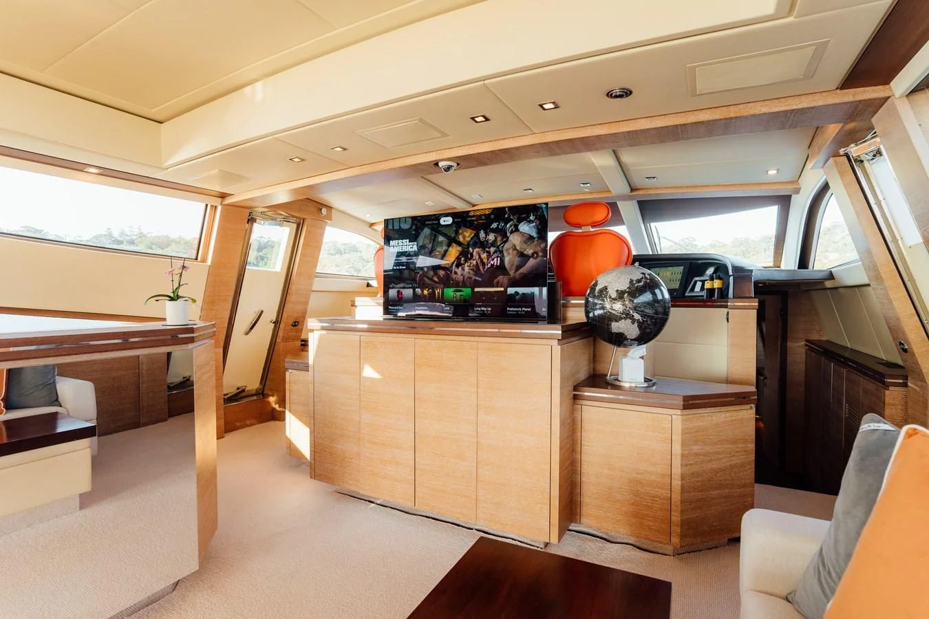 a room with a large desk and a fan aboard YOLO Yacht for Sale