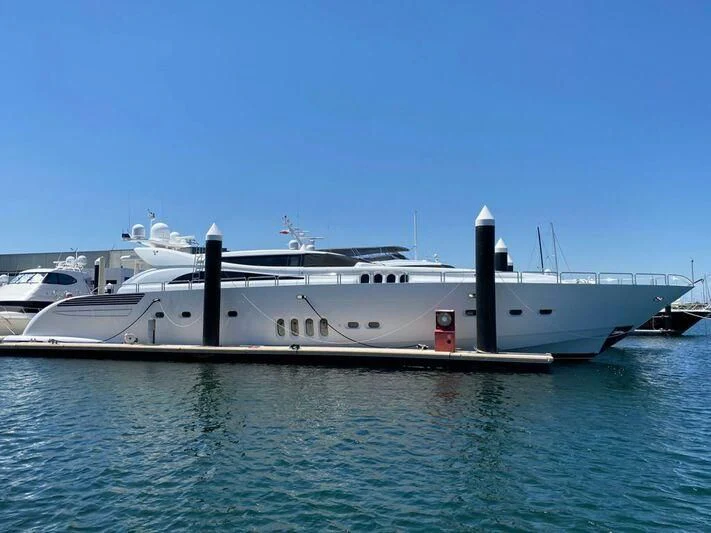 a large white yacht in the water aboard YOLO Yacht for Sale
