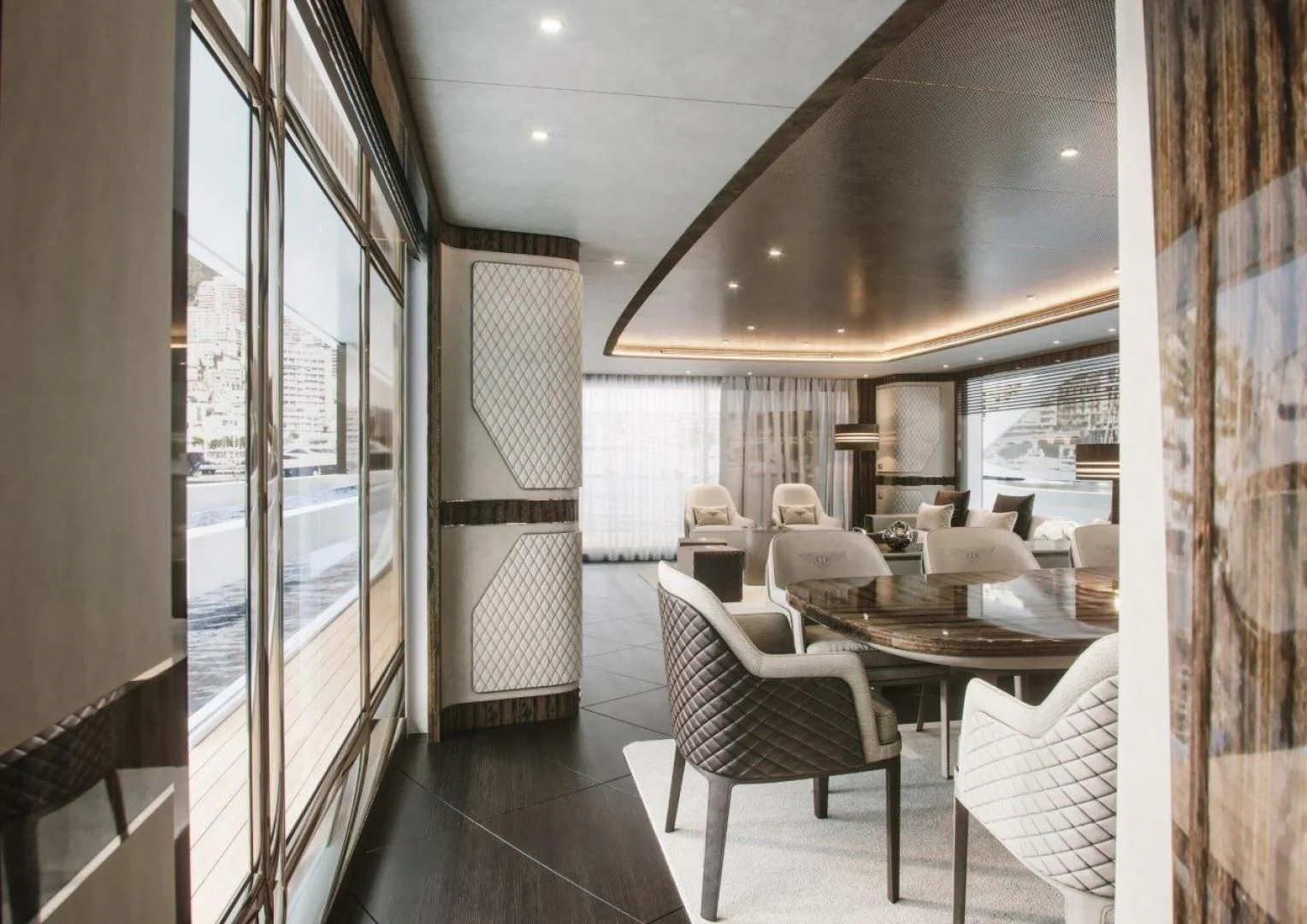 a room with a table chairs and a window aboard G 300 Yacht for Sale