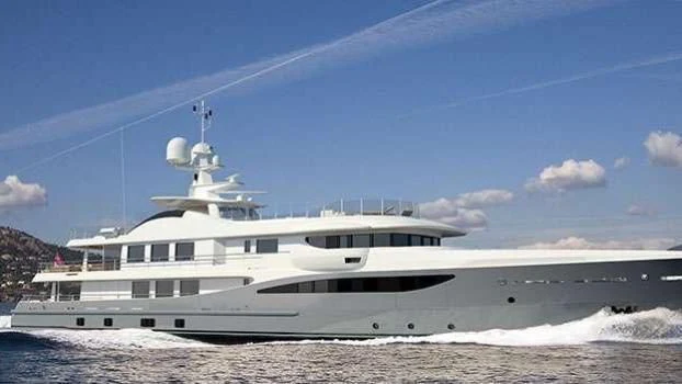 a large white boat on a beach aboard ASTRA Yacht for Sale
