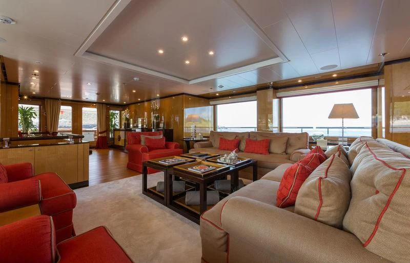 a living room with a couch and a table aboard ASTRA Yacht for Sale