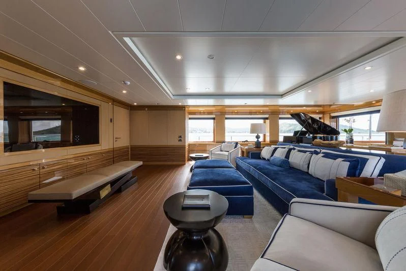 a living room with a couch and a table aboard ASTRA Yacht for Sale