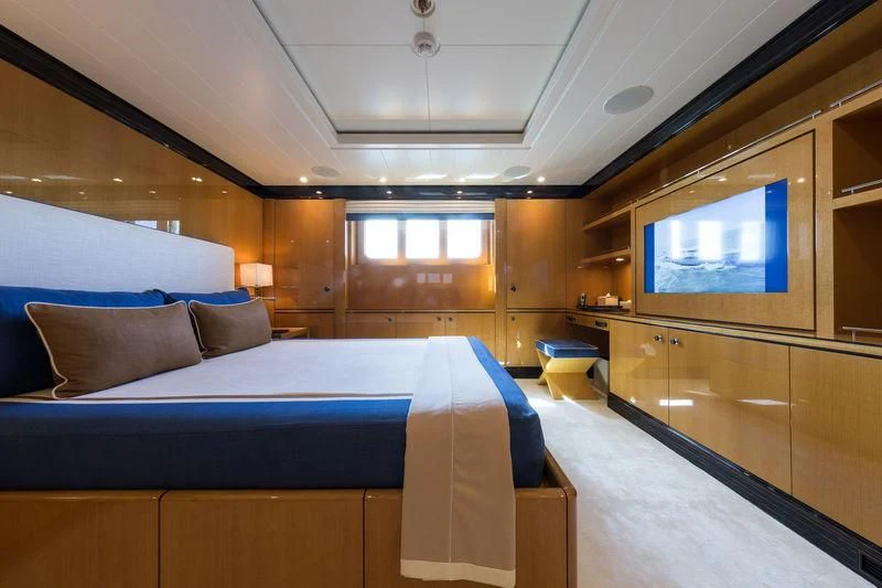 a room with a bed and a window aboard ASTRA Yacht for Sale