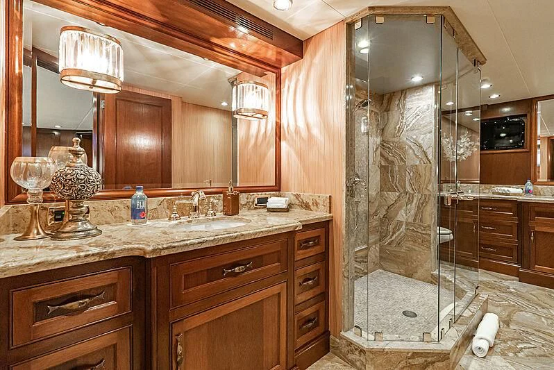a bathroom with a glass shower aboard LADY BAHI Yacht for Sale