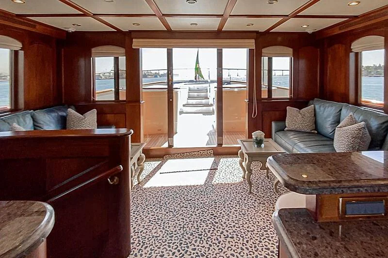 a living room with a large glass door aboard LADY BAHI Yacht for Sale