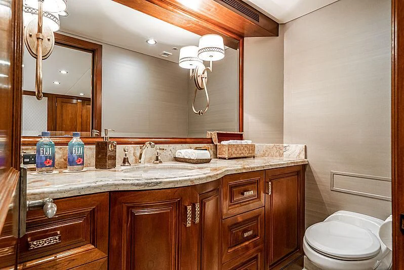 a bathroom with a sink and a toilet aboard LADY BAHI Yacht for Sale