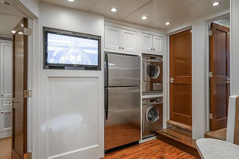 a kitchen with a large refrigerator aboard LADY BAHI Yacht for Sale