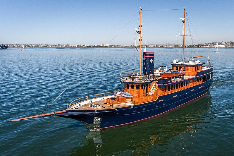 a red and blue boat on the water aboard LADY BAHI Yacht for Sale