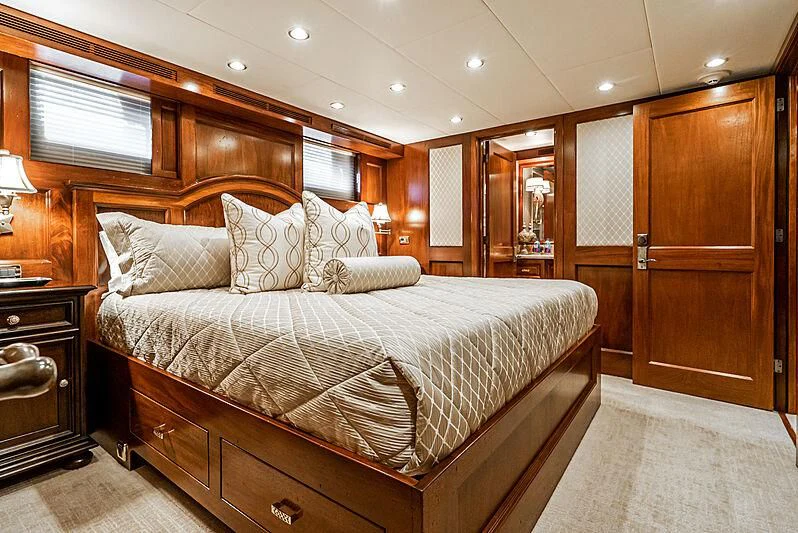 a large bed in a room aboard LADY BAHI Yacht for Sale