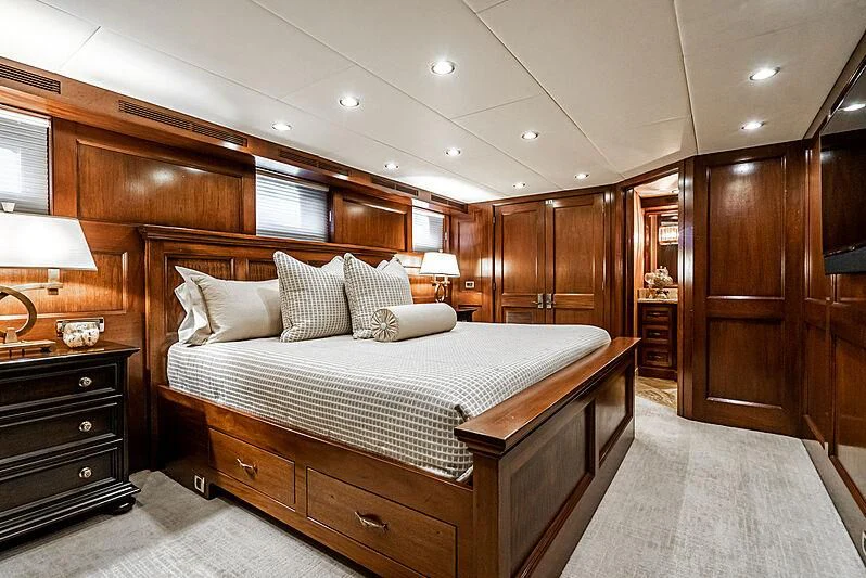 a large bed in a room aboard LADY BAHI Yacht for Sale