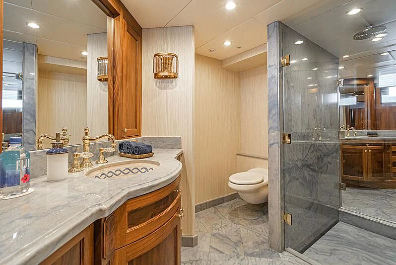 a bathroom with a glass shower aboard LADY BAHI Yacht for Sale