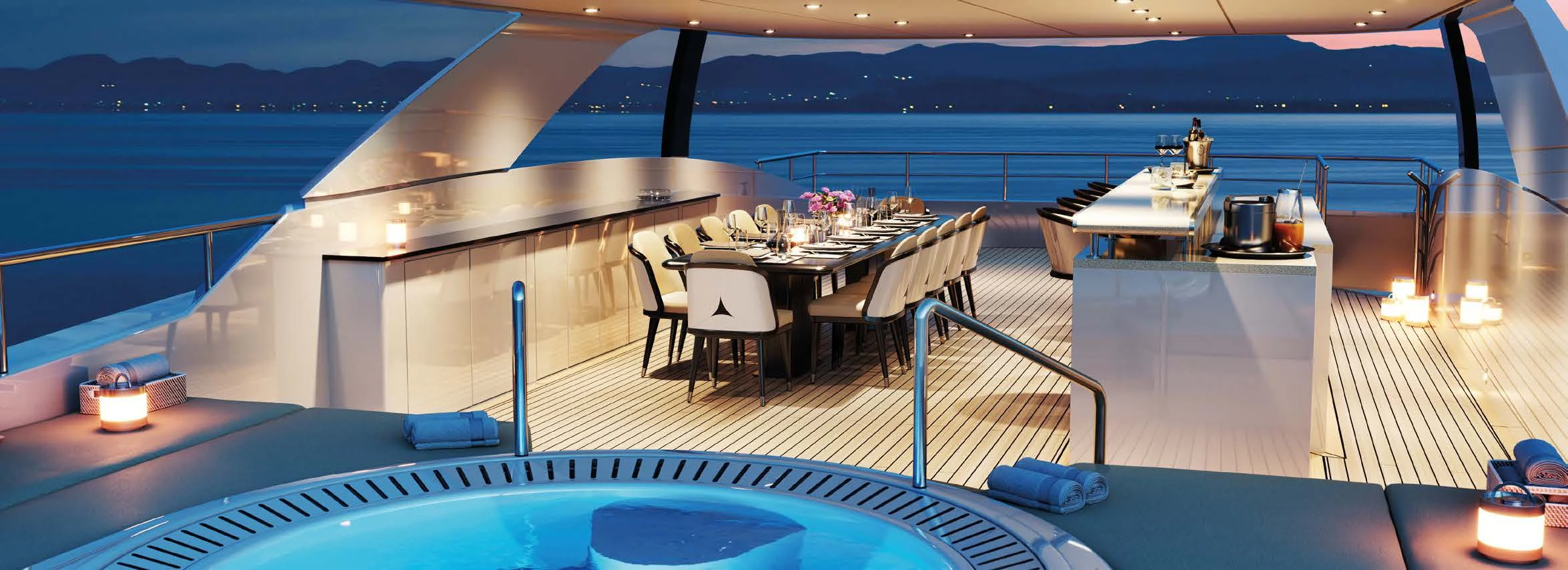 a deck with a table and chairs aboard ORION Yacht for Sale