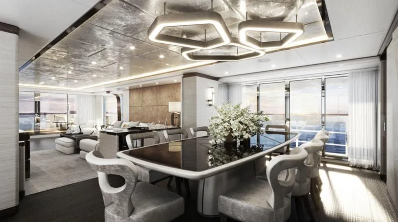 a room with a table chairs and a large window aboard ORION Yacht for Sale