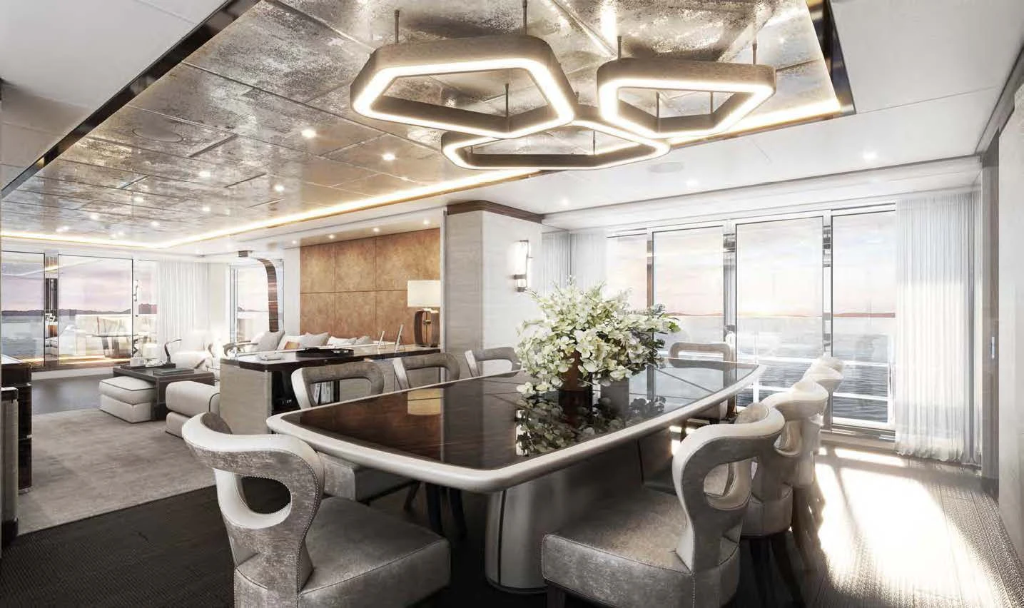 a large room with a table and chairs aboard ORION Yacht for Sale
