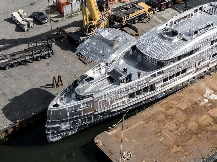 a large cruise ship docked aboard ORION Yacht for Sale