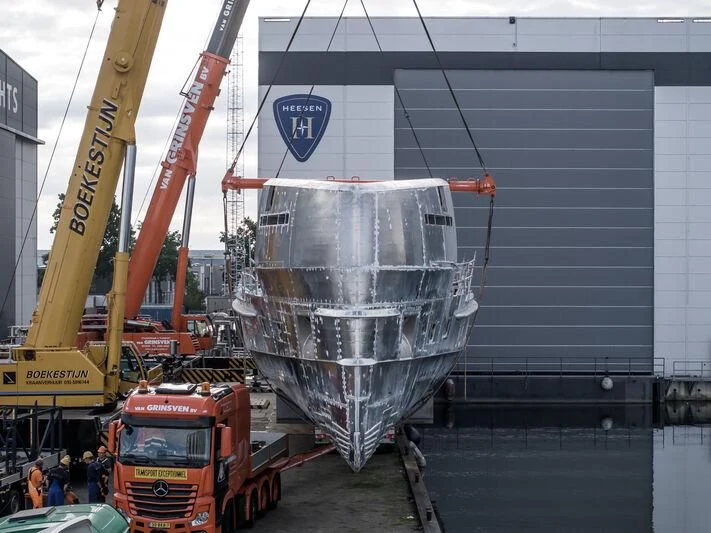 a crane lifting a container aboard ORION Yacht for Sale