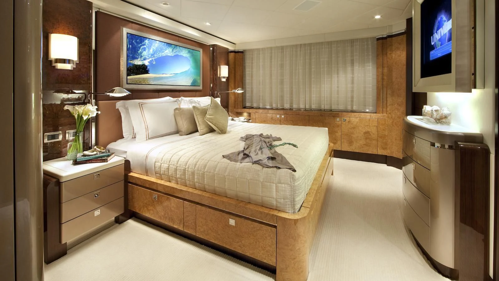 a hotel room with a bed and tv aboard SYCARA V Yacht for Sale