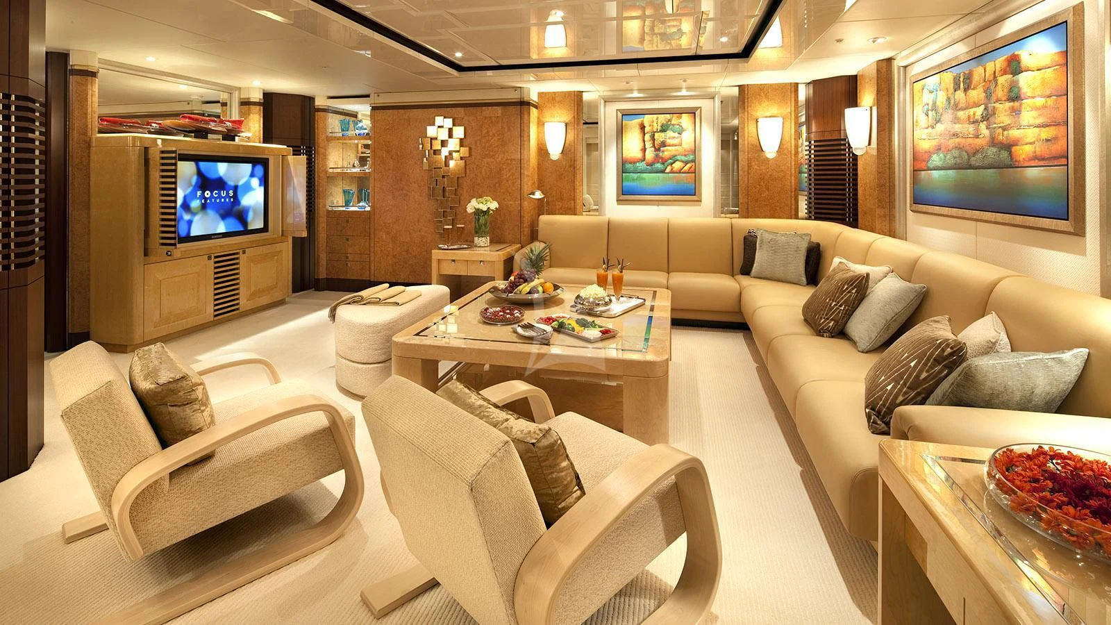a living room with a large television aboard SYCARA V Yacht for Sale