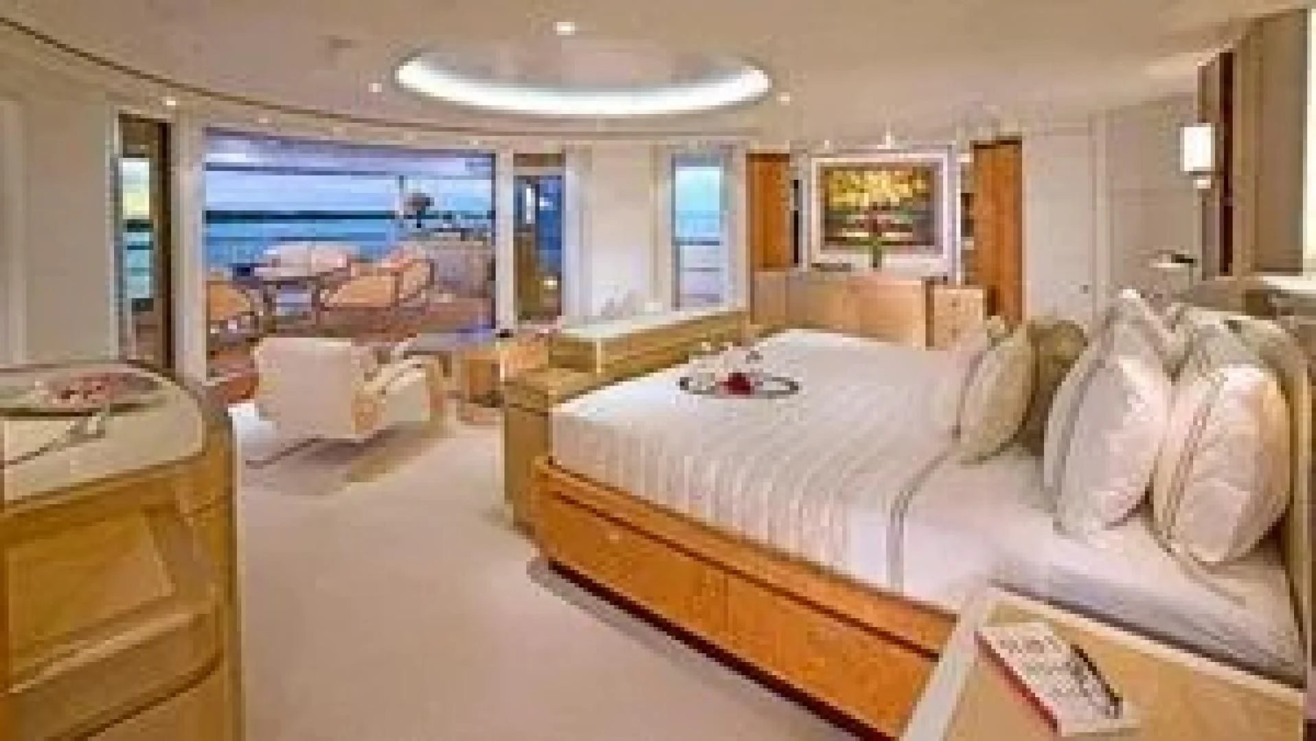 a large bedroom with a large bed aboard SYCARA V Yacht for Sale