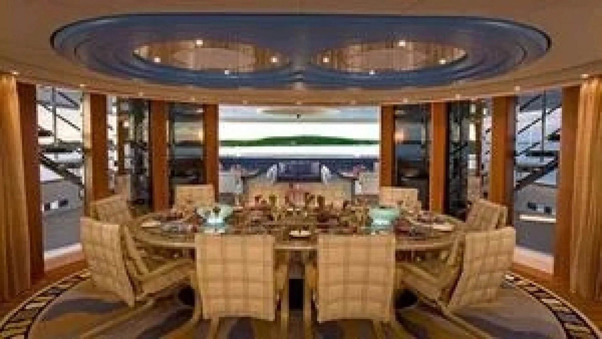 a dining room with a large chandelier aboard SYCARA V Yacht for Sale