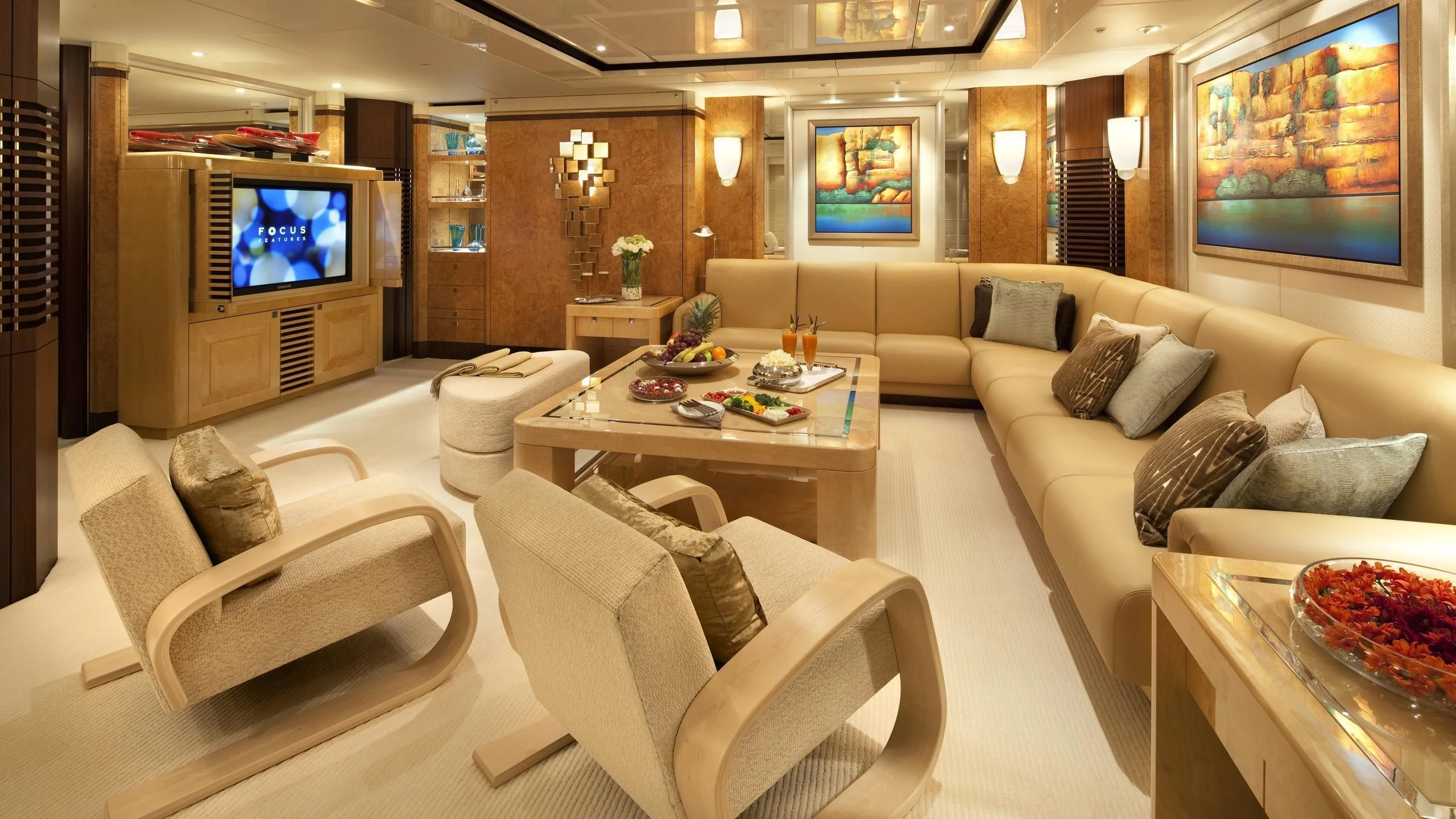 a living room with a large television aboard SYCARA V Yacht for Sale
