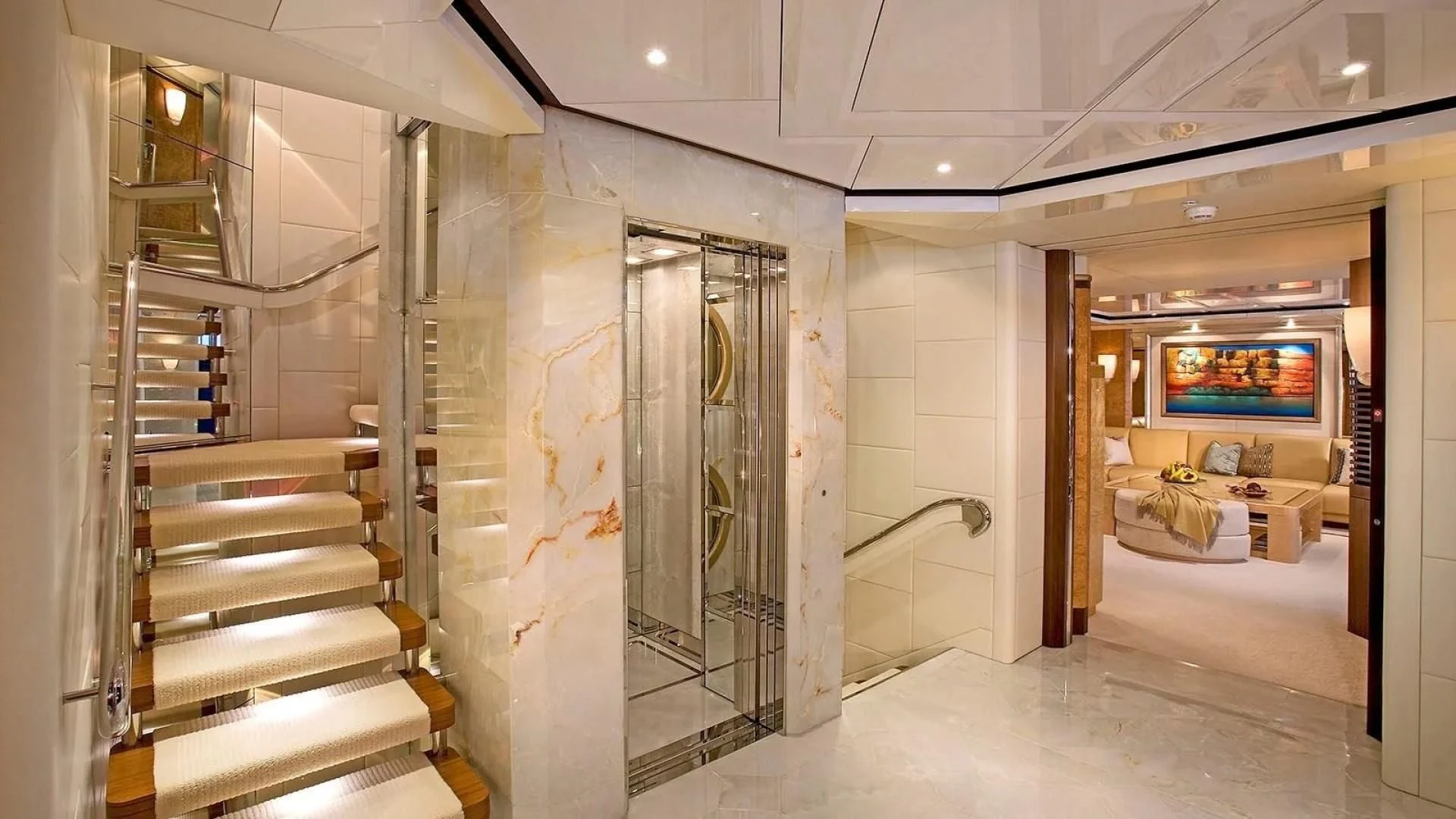 a room with a staircase and glass doors aboard SYCARA V Yacht for Sale