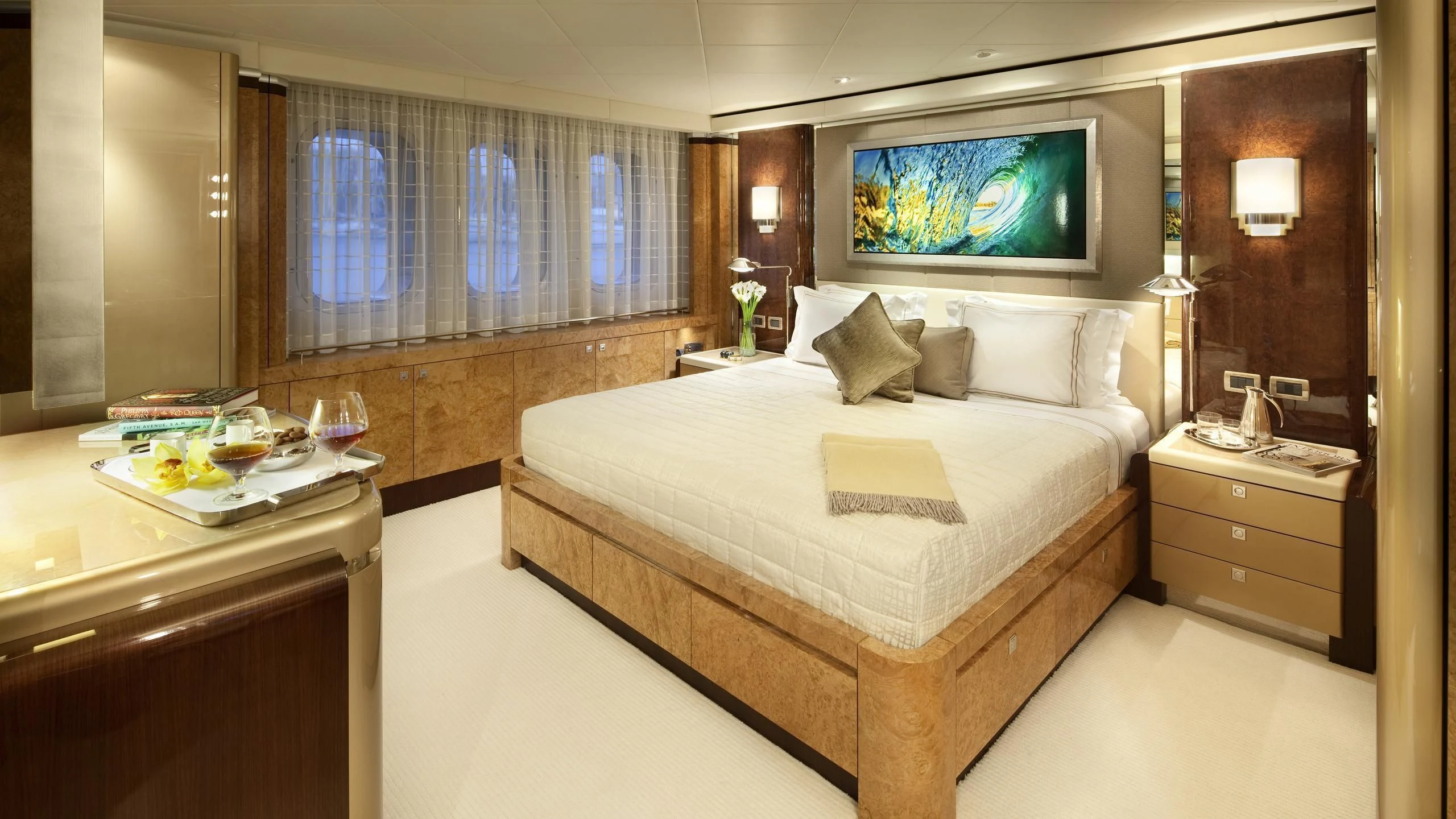 a hotel room with a bed and a tv aboard SYCARA V Yacht for Sale