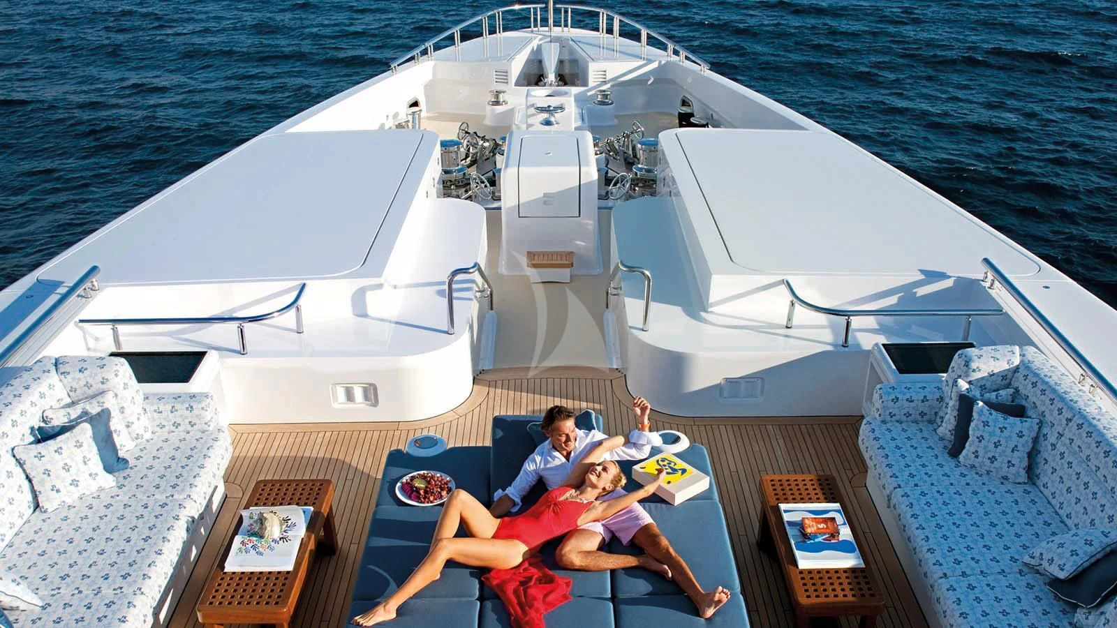 a couple of people on a boat aboard SYCARA V Yacht for Sale