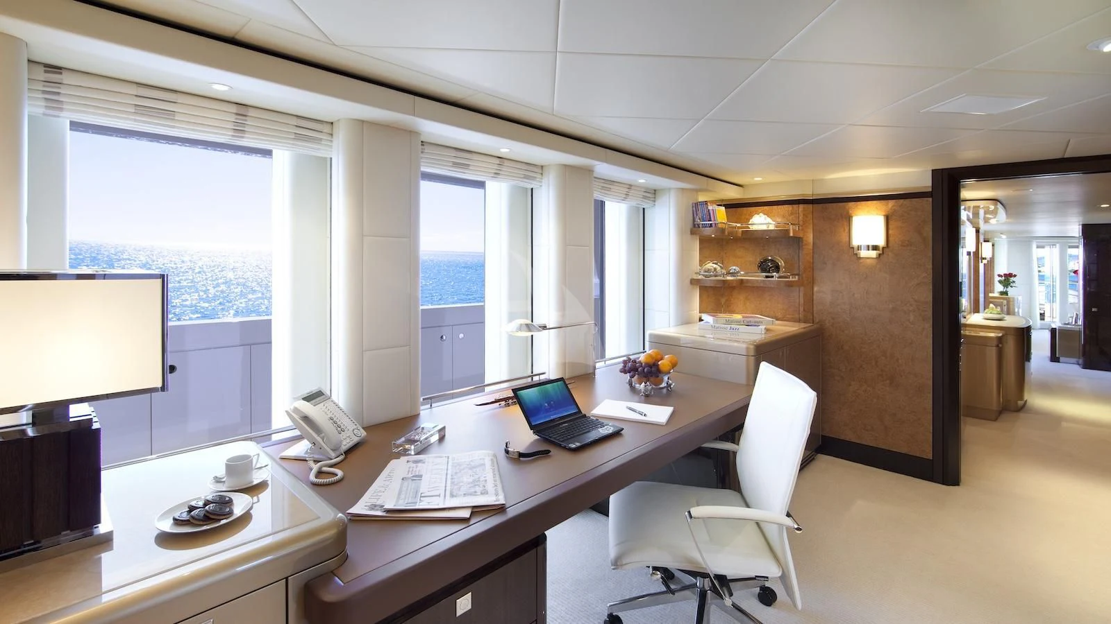 an office with a laptop and a desktop computer aboard SYCARA V Yacht for Sale