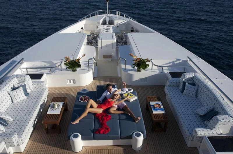 a couple sitting on a boat aboard SYCARA V Yacht for Sale