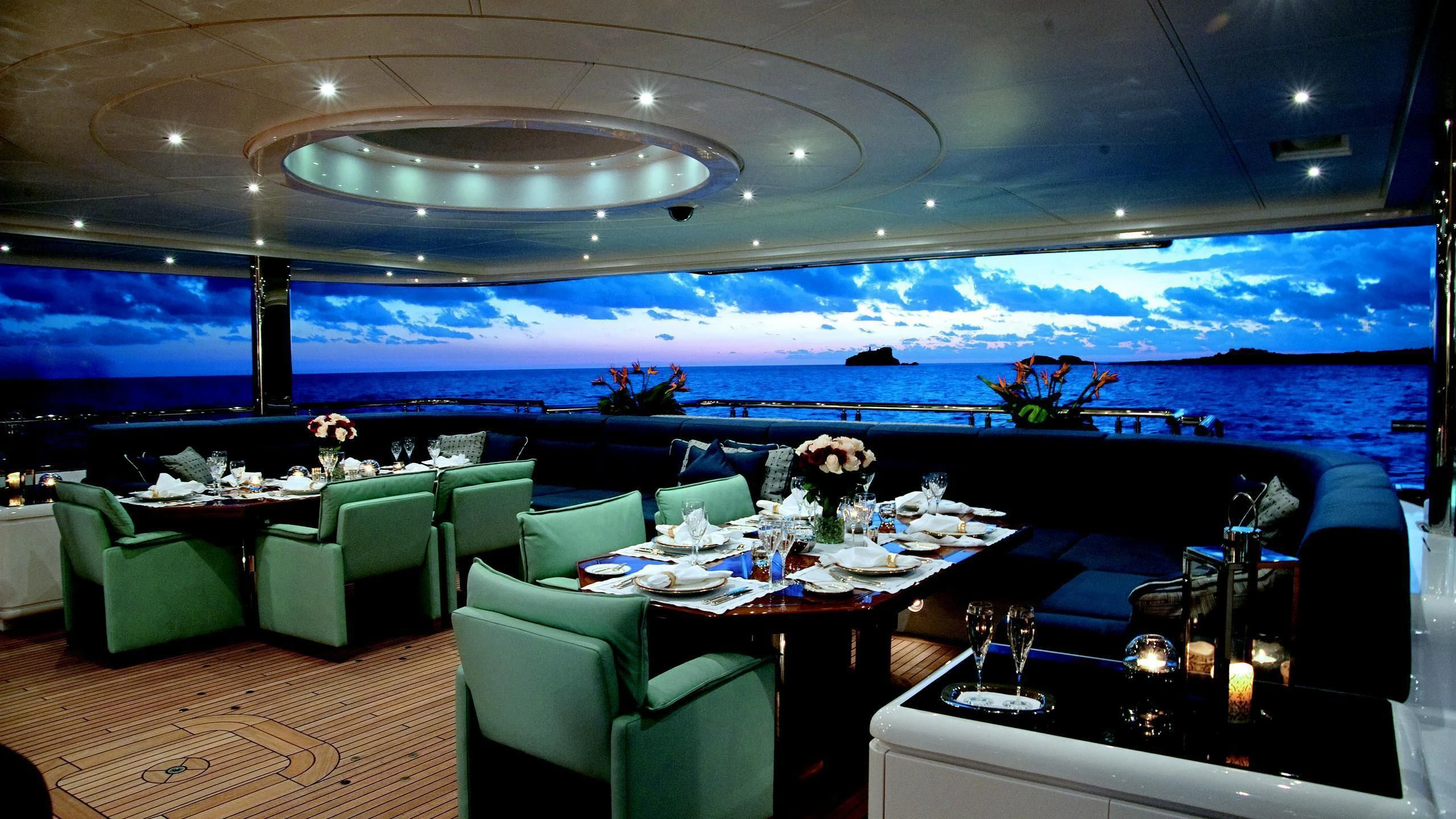 a room with a table and chairs aboard SYCARA V Yacht for Sale