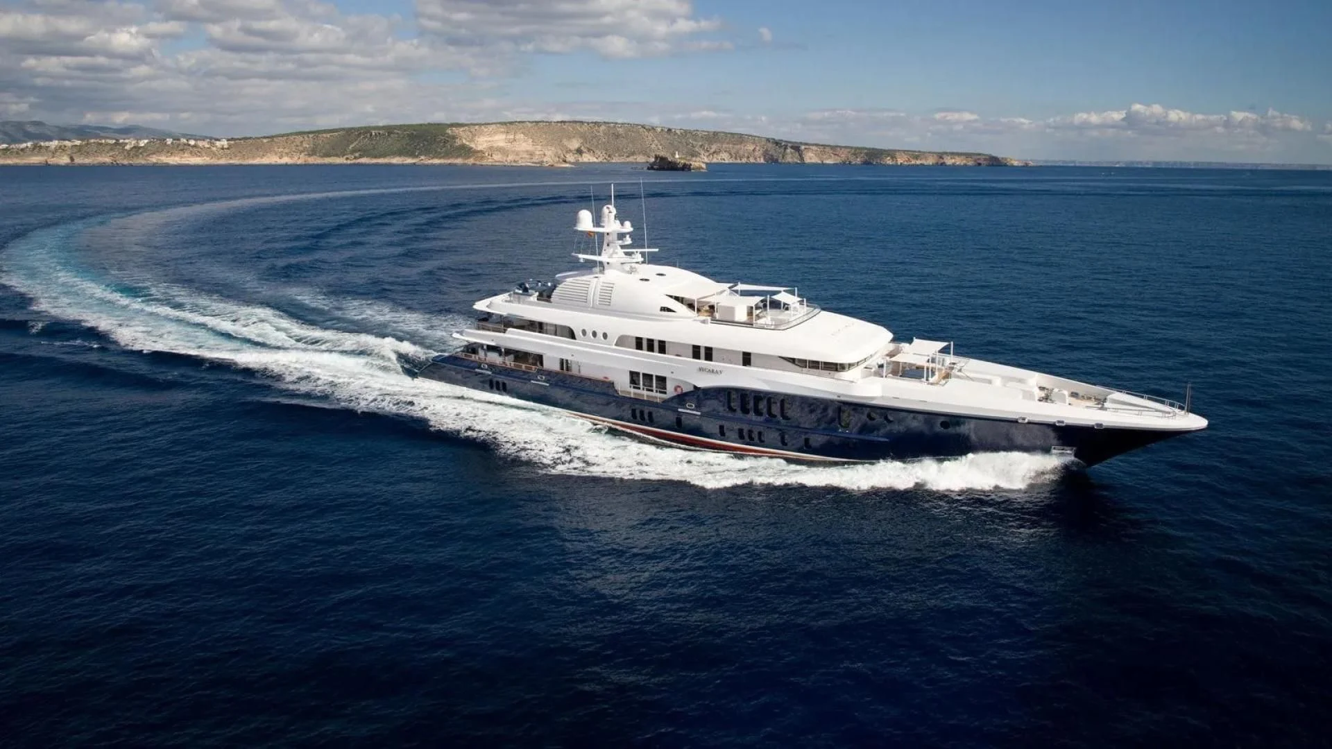 a large white ship on the water aboard SYCARA V Yacht for Sale