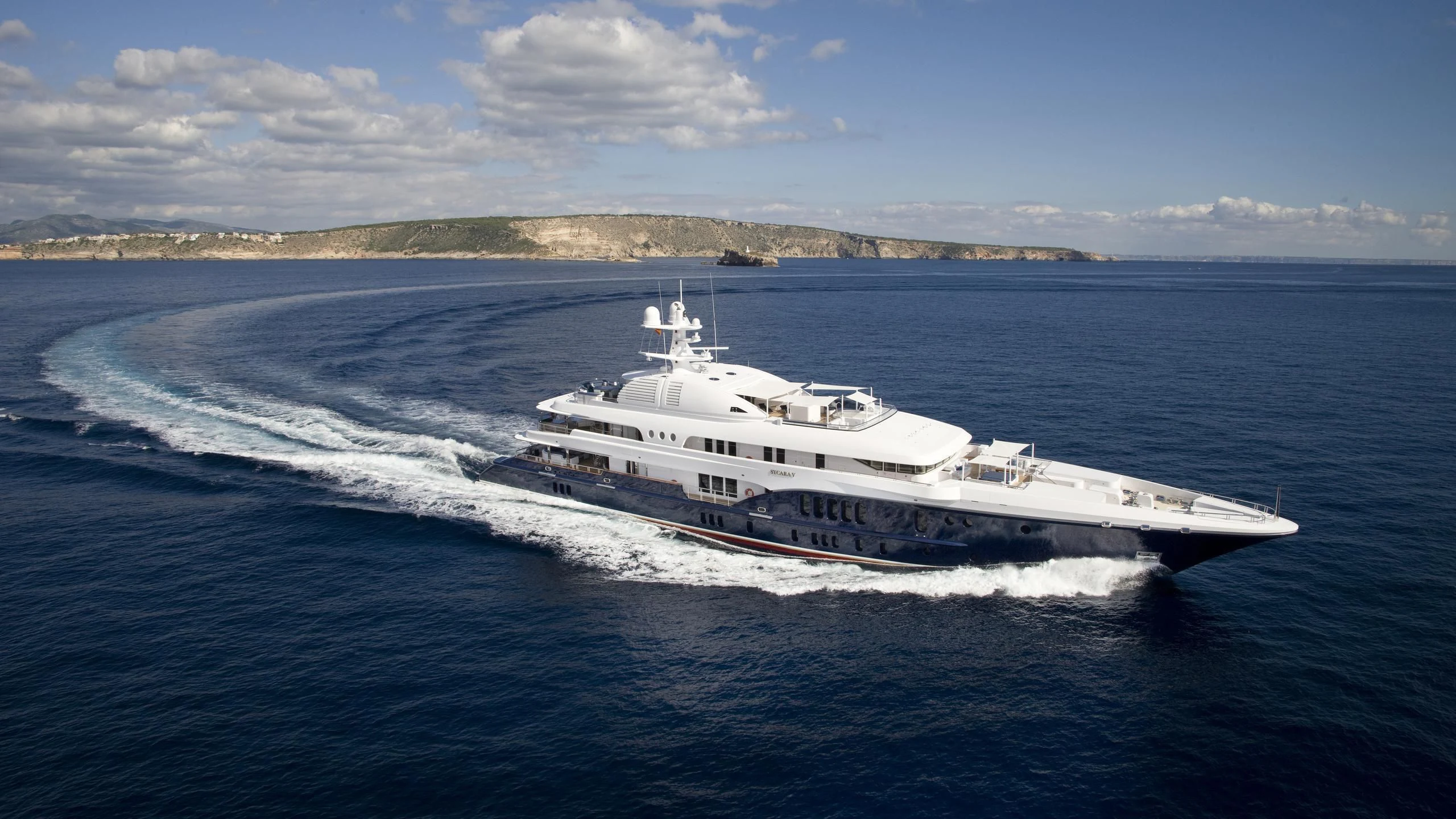 a large white boat on the water aboard SYCARA V Yacht for Sale