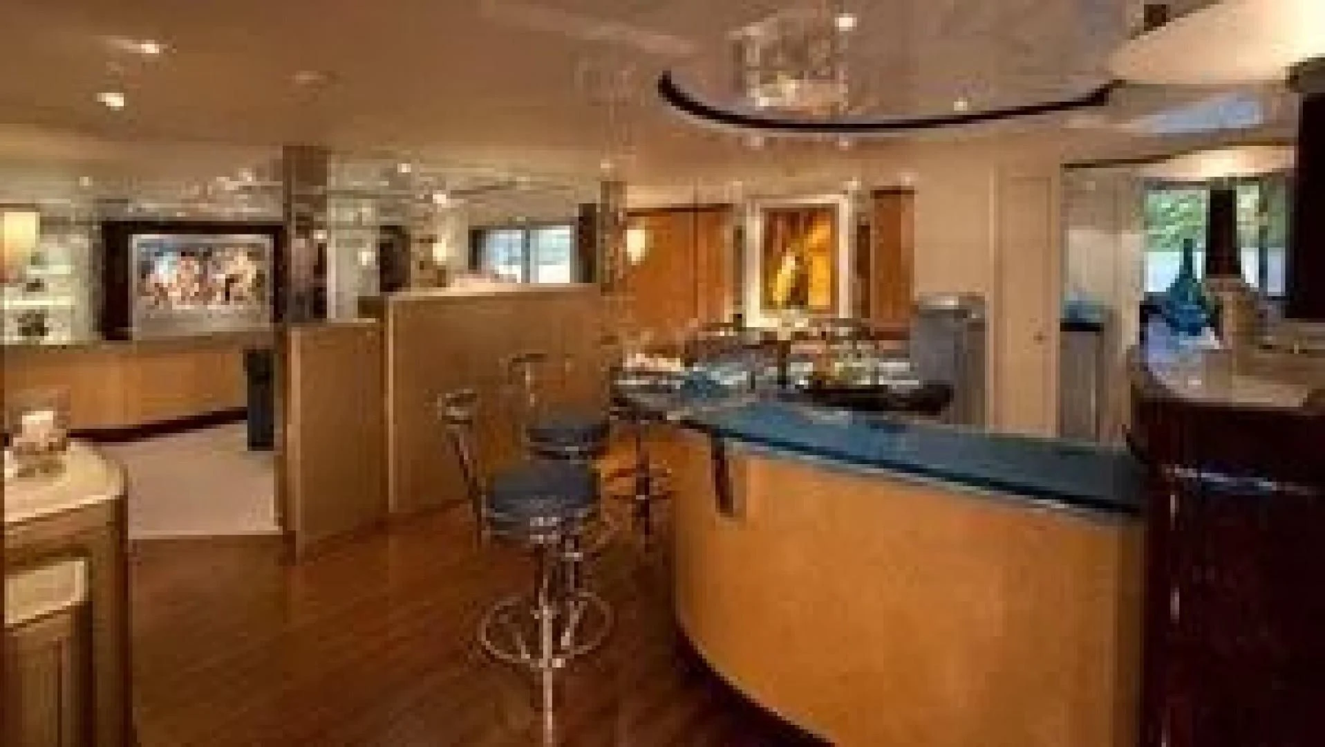 a large kitchen with a bar and a bar aboard SYCARA V Yacht for Sale