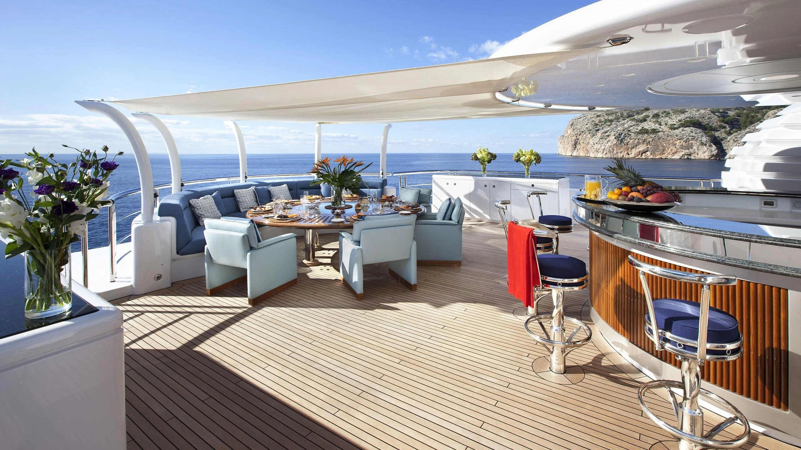 a large living room with a large patio and a large pool aboard SYCARA V Yacht for Sale