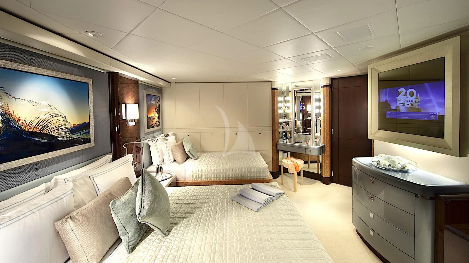 a large living room with a large screen on the wall aboard SYCARA V Yacht for Sale