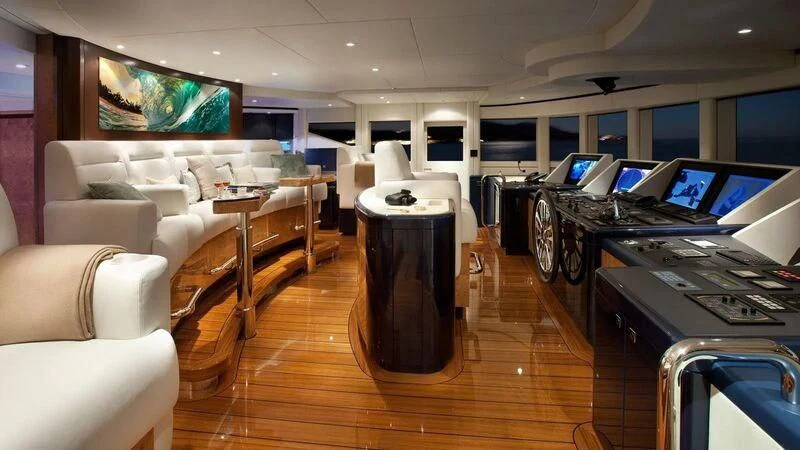a room with a couch and a television aboard SYCARA V Yacht for Sale
