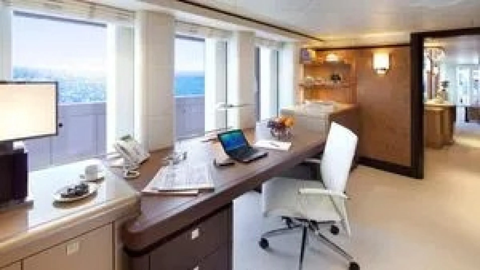 a room with a desk and a laptop aboard SYCARA V Yacht for Sale