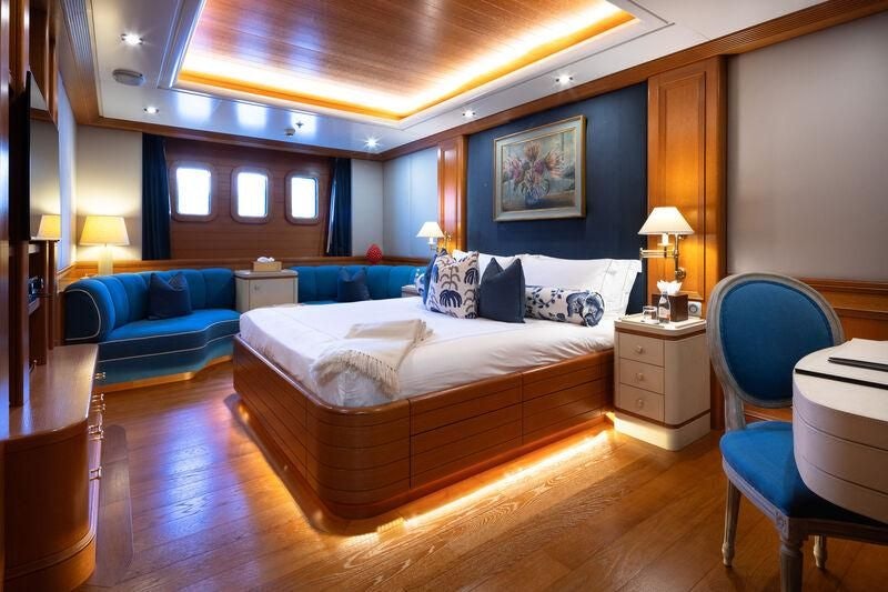 a large bedroom with a large bed aboard BOADICEA Yacht for Sale