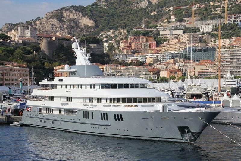 a large white yacht in the water aboard BOADICEA Yacht for Sale