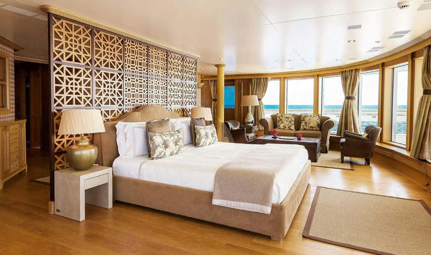 a large bedroom with a large bed aboard BOADICEA Yacht for Sale
