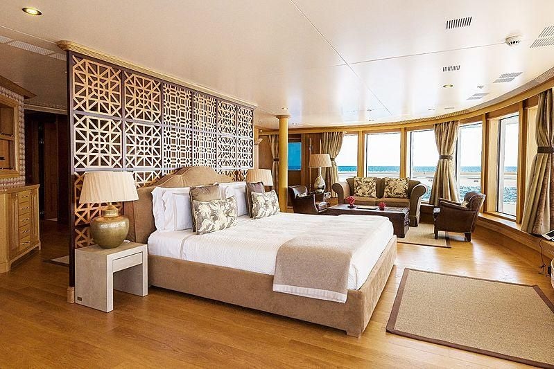 a large bedroom with a large bed aboard BOADICEA Yacht for Sale