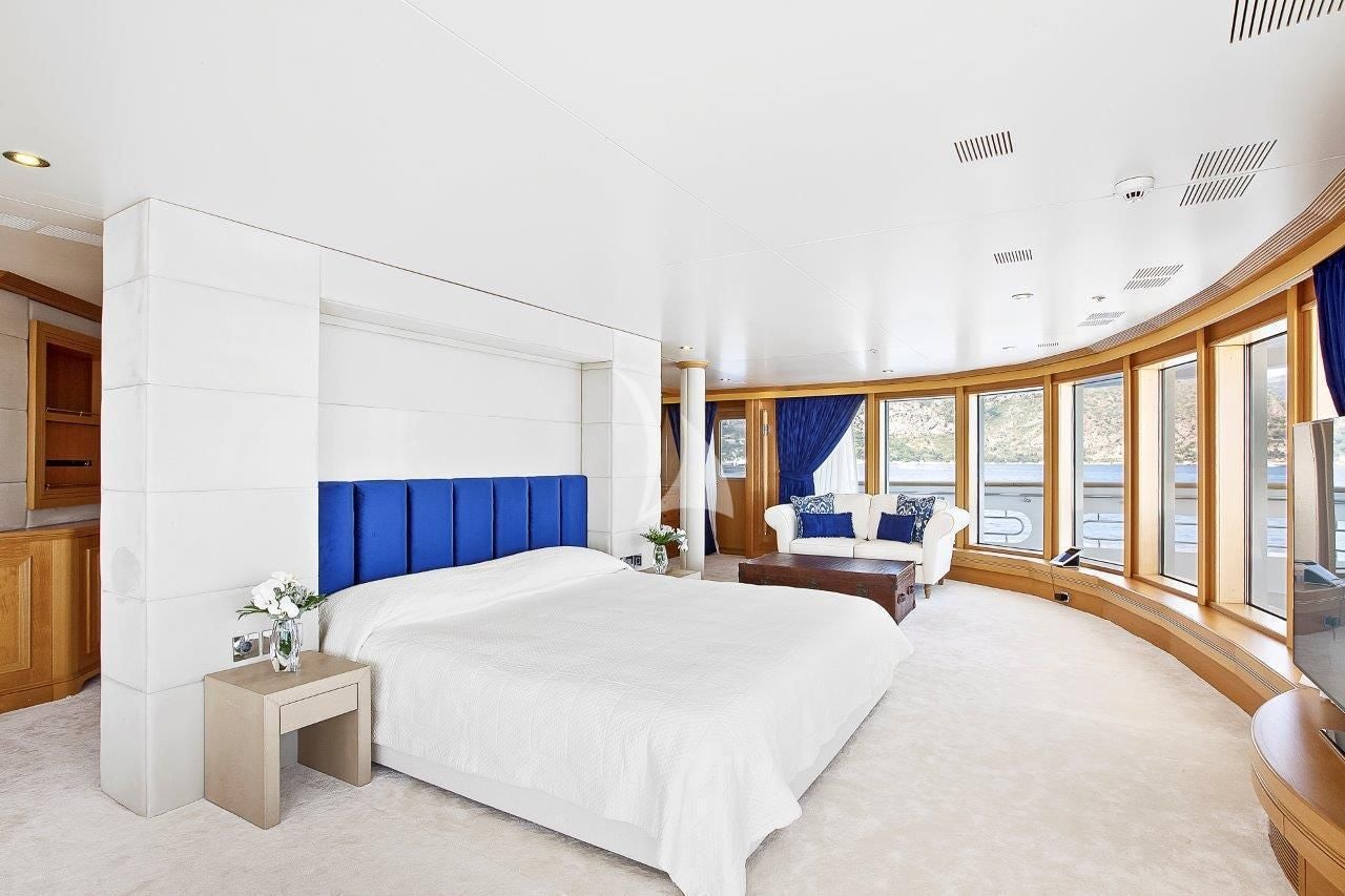 a bedroom with a large bed aboard BOADICEA Yacht for Sale