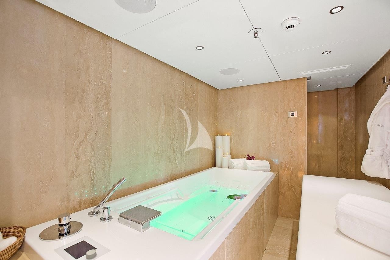 a bathroom with a tub and sink aboard BOADICEA Yacht for Sale
