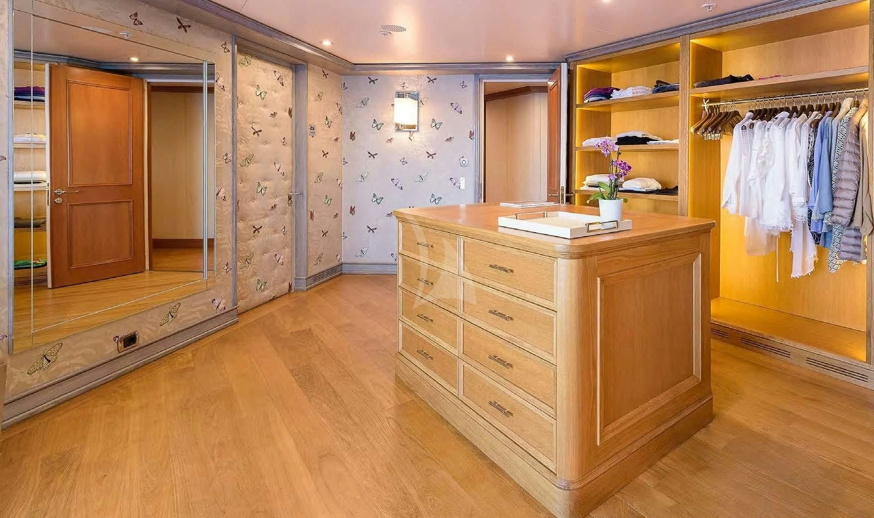 a room with a cabinet and a mirror aboard BOADICEA Yacht for Sale