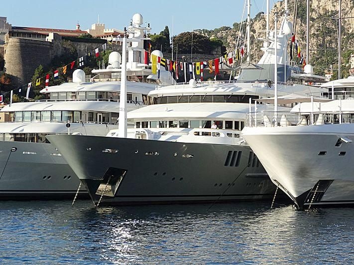 a couple of boats in a harbor aboard BOADICEA Yacht for Sale