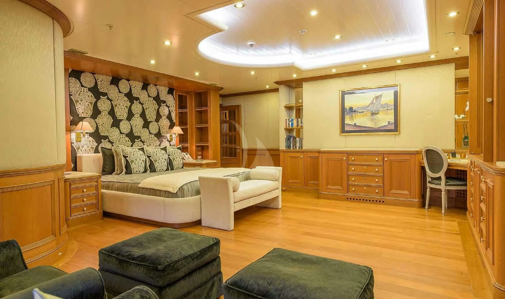 a living room with a large fireplace aboard BOADICEA Yacht for Sale