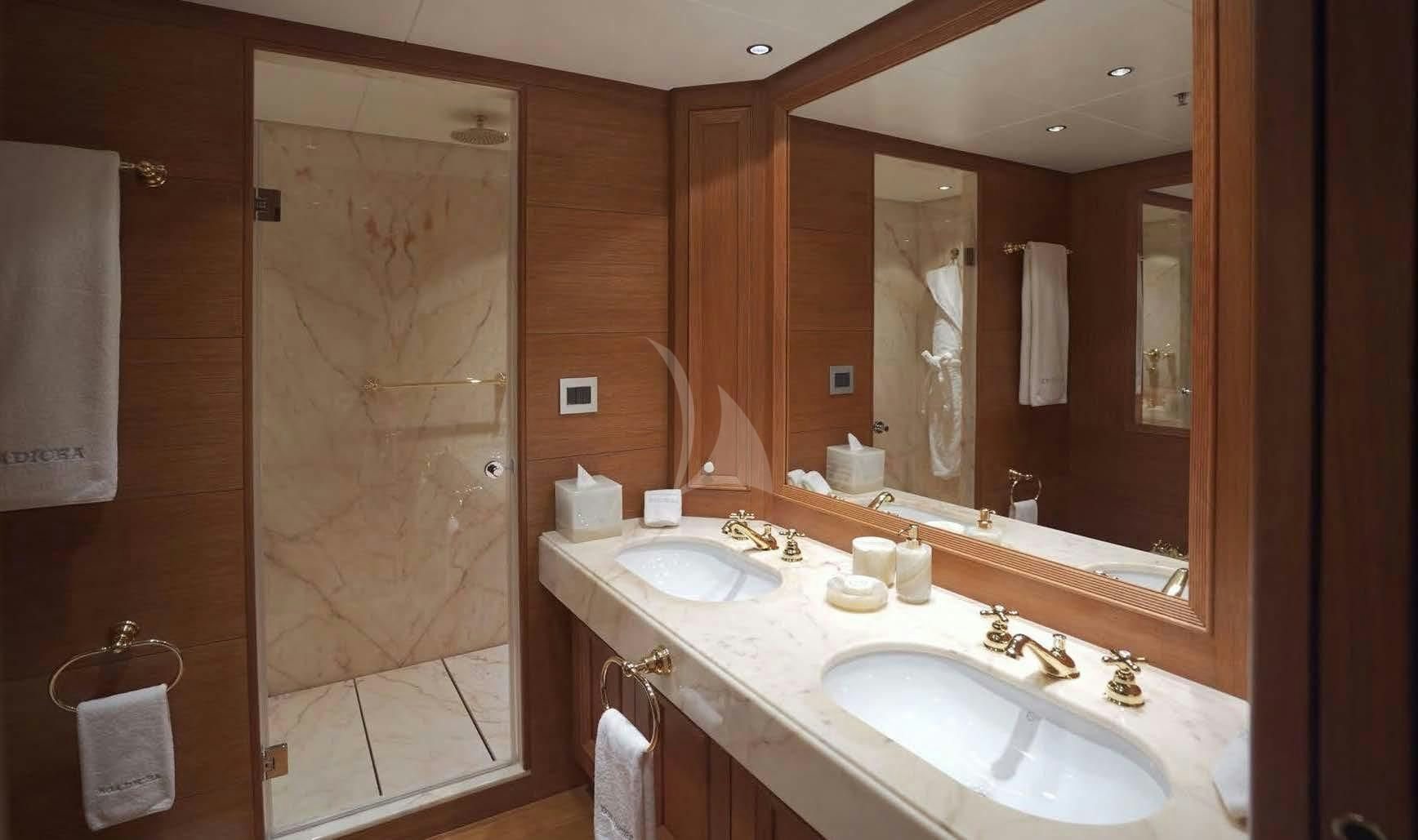 a bathroom with a large mirror aboard BOADICEA Yacht for Sale